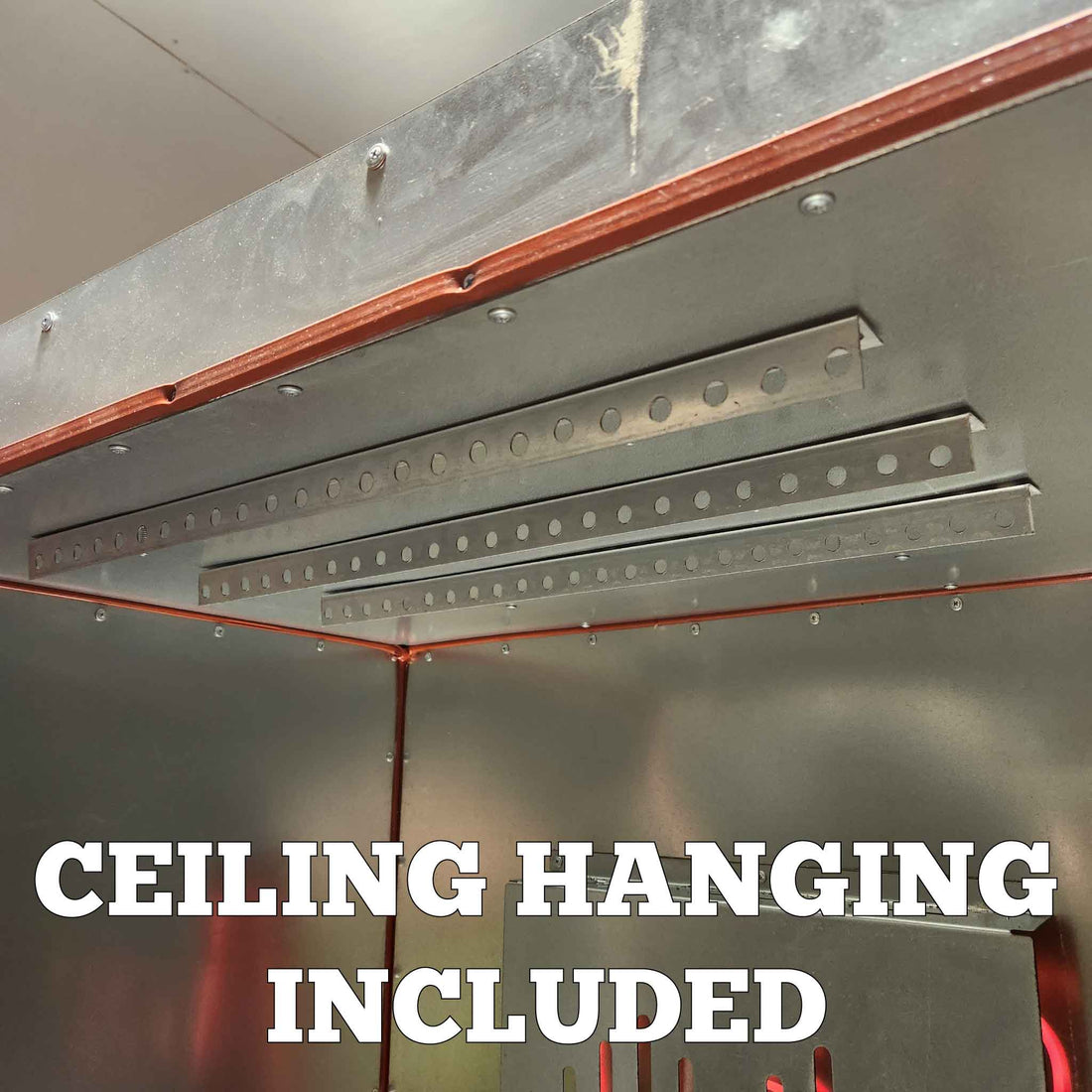 Included ceiling hanging rails inside a Light Armor oven for hanging parts